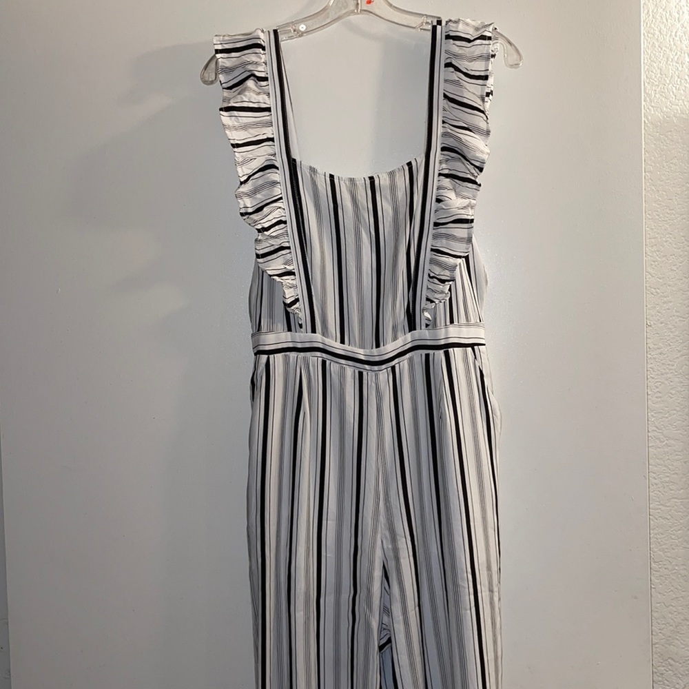 SOLEMIO STRIPPED RUFFLE APRON JUMPSUIT...SIZE LARGE...BLACK AND WHITE...